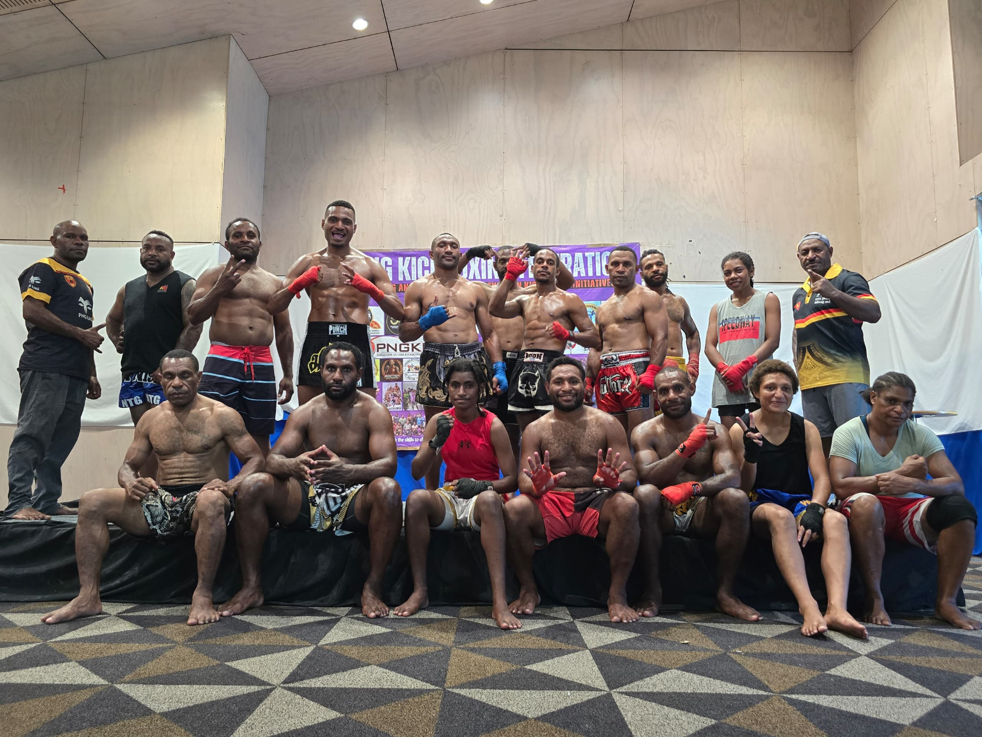 PNG kickboxers posing together in fight gear after weigh-in